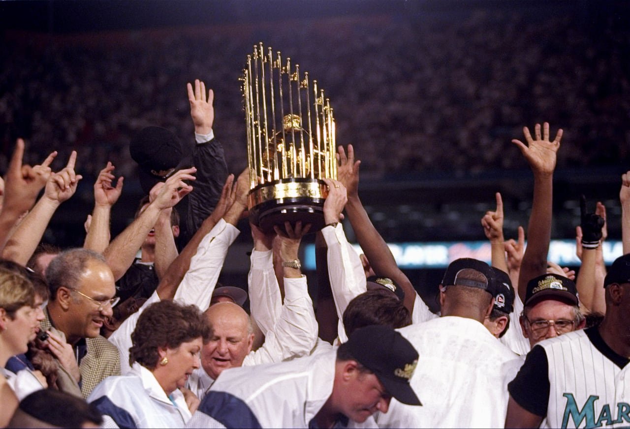 default-164 Players hoist a trophy in the air